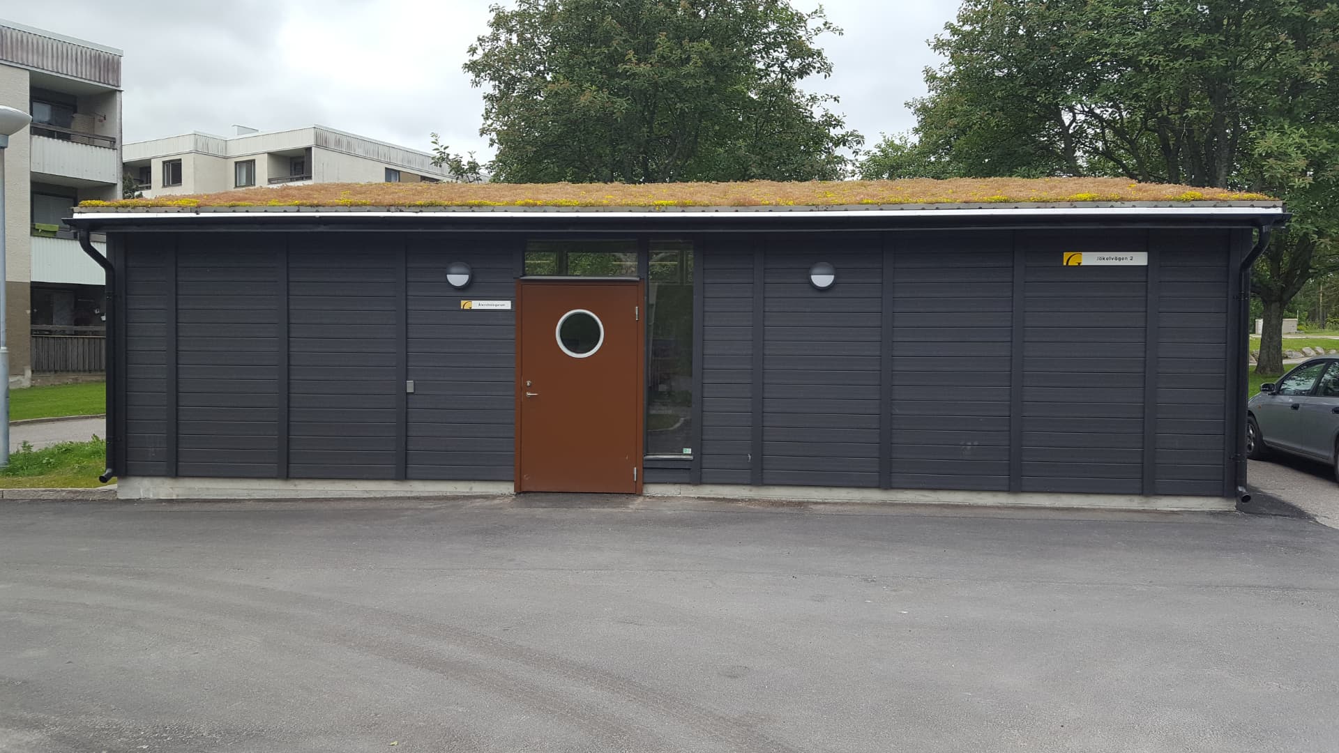 Waste house with sedum roof and dark grey façade delivered to a residential property